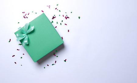 Green gift box wrapped and ribbon on white background.の写真素材