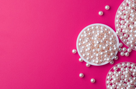 Pile of pearls on the pink backgroundの写真素材