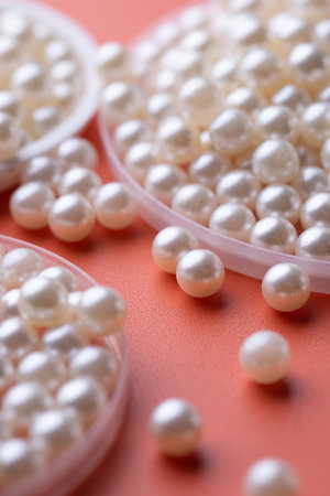 Pile of pearls on the orange backgroundの写真素材