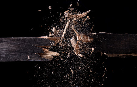Broken wood,Dust and wood chips on a black backgroundの写真素材