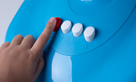 Hand pressing the fan adjustment buttonの写真素材