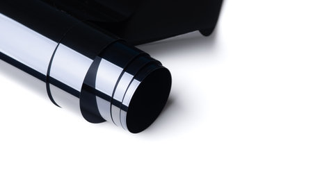 Roll of automobile film before installed to glass surface isolated on whiteの写真素材