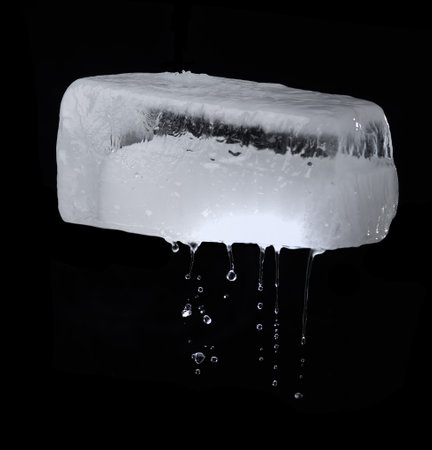 Melting Ice cubes with water drops on black background,rectangular ice blockの写真素材