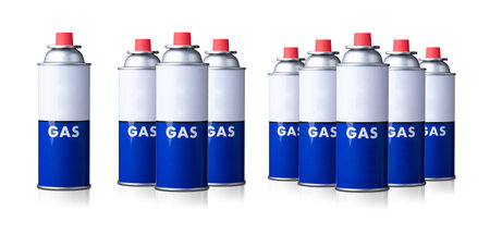 Portable gas cylinder for portable gas appliances with closed red cap isolated on white background