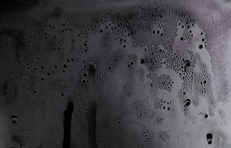 Full frame shot of water drops on a windowの写真素材