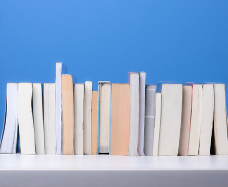 Books on the shelf,Blue backgroundの写真素材