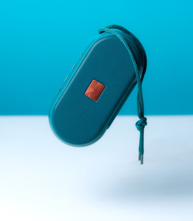 Portable wireless speaker on green backgroundの写真素材