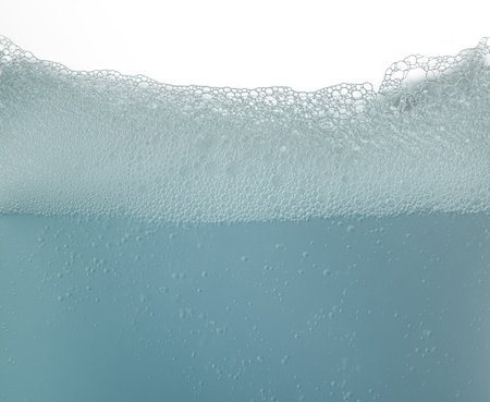 Soap foam surface,soap bubbles against white backgroundの写真素材