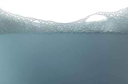 Soap foam surface,soap bubbles against white backgroundの写真素材