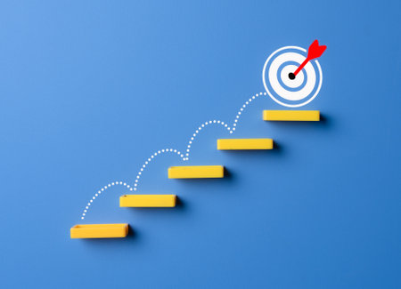 Stairs made by wooden blocks with the target icon at the top. goals concept, achievement or business progress goal concept.の写真素材