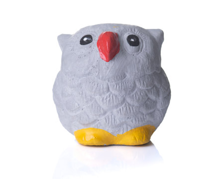 Terracotta Statue of a owl on white background.の写真素材