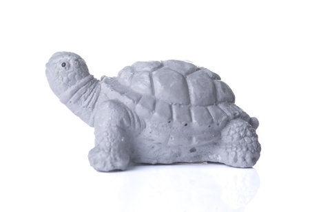 Terracotta Statue of a turtle on white background.の写真素材