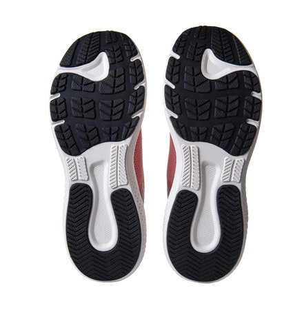 Black and white treaded soles of athletic shoesの写真素材
