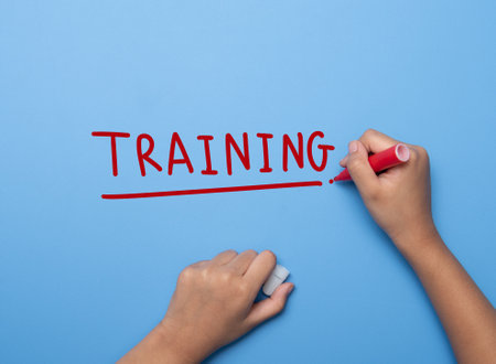 Hand writing TRAINING with marker, concept backgroundの写真素材