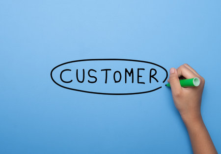 Hand writing CUSTOMER with marker, concept backgroundの写真素材