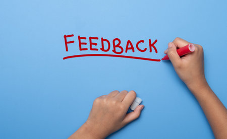 Hand writing FEEDBACK with marker, concept backgroundの写真素材