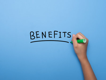 Hand writing BENEFITS with marker, concept background