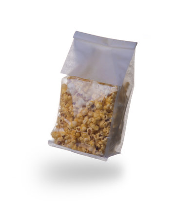 Plastic bag of popcorn on a white backgroundの写真素材