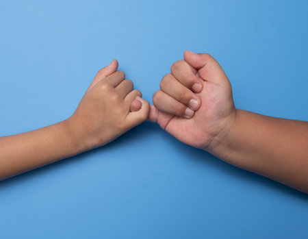 Two people making a bet in front of a blue background,Unity conceptの写真素材