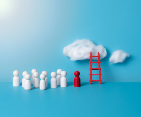 Wooden people figures with serene wooden ladder and a red heart-shaped cloud floating on a blue backgroundの写真素材