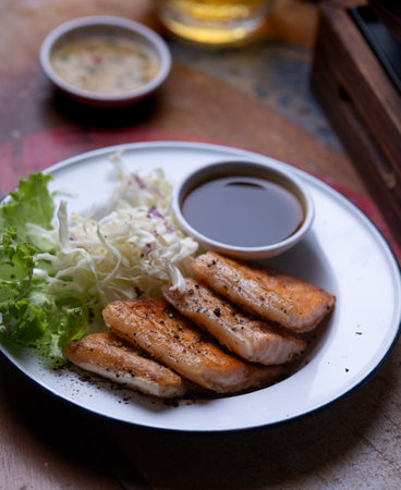 Grilled Salmon Belly on the dining tableの写真素材