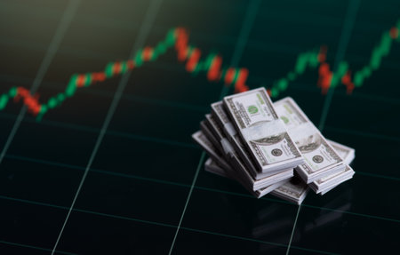 Banknotes over digital screen with real life exchange chart, USD EUR parity concept, Concept of wealth and investmentの写真素材