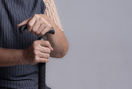 Hands of old woman asia with a cane walking stickの写真素材