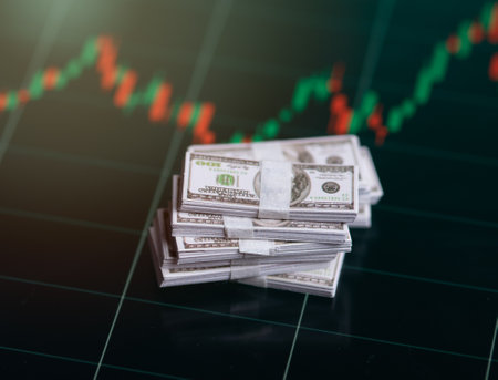 Banknotes over digital screen with real life exchange chart, USD EUR parity concept, Concept of wealth and investmentの写真素材