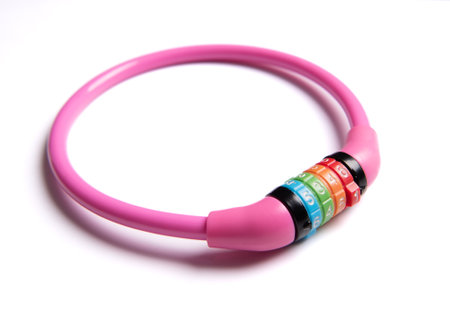 A pink combination bicycle lock isolated on whiteの写真素材