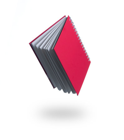 Floating Book, Book is opened and flying through the air isolated on white