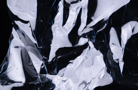 full frame abstract background of crumpled black plastic film bag
