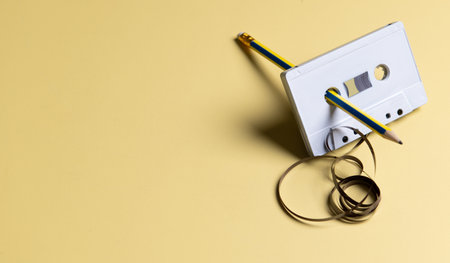 Old audio tape on a yellow background. Music conceptの写真素材