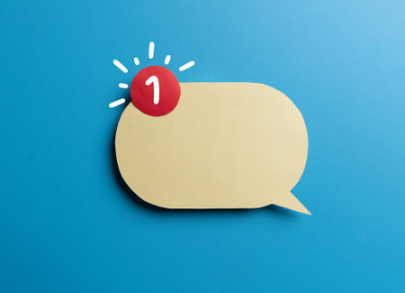 Yellow speech bubble with envelope and red notification badge on blue background. Concept of new message alert, email communication,の写真素材