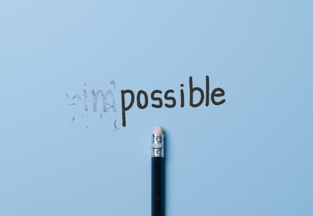 Changing the word impossible to possible with a pencil eraser.Examination for fix and correct or change some incorrect and problem in business concept.の写真素材