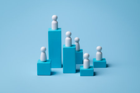 Wooden figure standing on wooden podium for business leadership for team leader concept.の写真素材