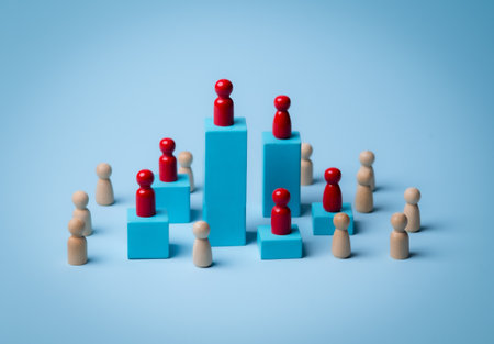 Red wooden figure standing on wooden podium for business leadership for team leader concept.の写真素材