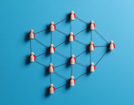 Wooden human figures connected by glowing thread â HR network and team connectivity
 on blue Backgroundの写真素材