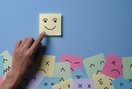 Happy smile face for medical care concept,Mind, Mental Health Concept. Varieties of Mood and Emotion Inside Out. many Sticky Notes on Board with Handwriting Cartoon Emoticon Faceの写真素材