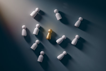 Gold wooden figures stand out from the crowd of wooden figures. Leadership concept,top viewの写真素材