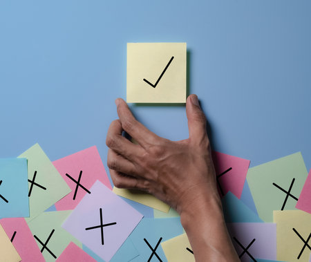 Sticky Notes on Board,Businessman is thinking and making choices right from wrong symbols. Decide to vote accept or not. Yes or No decisions, business options in difficult situations.の写真素材