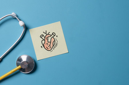 Heart Illustration on paper and Stethoscope ,light blue backgroundâ Cardiology Conceptの写真素材