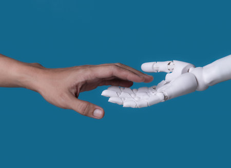 vThe Connection: Human and Robotic Hands Reaching Out