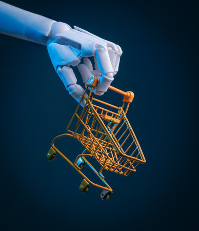 Robot Hand Holding a Miniature Shopping Cart: AI E-commerce, Automation, and Retail Conceptの写真素材