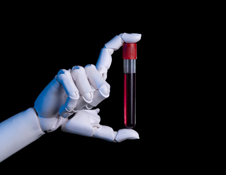 Robot Hand Holding a Blood Test Tube for Laboratory Analysisの写真素材