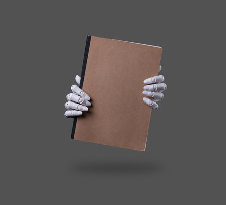 Robot Hands Holding a Blank Brown Notebookの写真素材