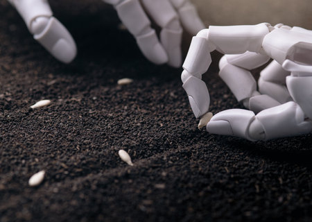 Precision Seeding: Close-Up of Robotic Hand Planting a Single Seed in Soilの写真素材