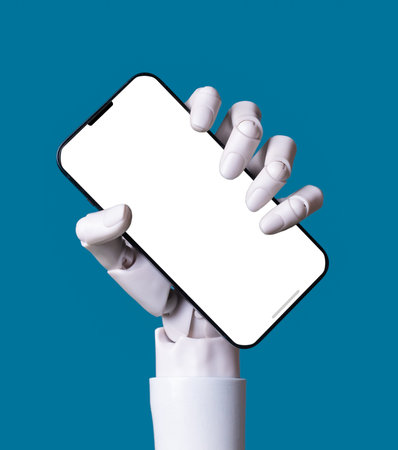 AI Robot Hand Holding Smartphone with Blank Screen on Blue Backgroundの写真素材