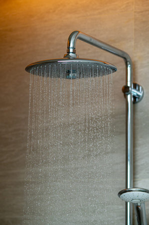 Rain Shower Head with Water Spraying in Modern Luxury Bathroom