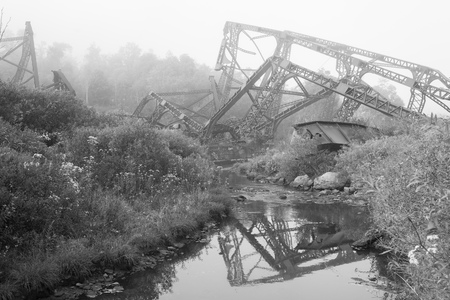 Collapsed Metal Framing from Bridge over Creekの写真素材