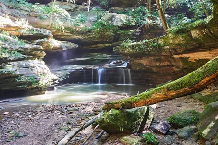A beautiful, lush waterfall flowing nearby Old Man's Cave in Hocking Hills State park. The creek...